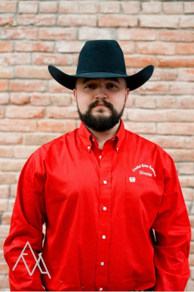 Photo of Hunter Neuharth in red CRR oxford with black hat and black beard