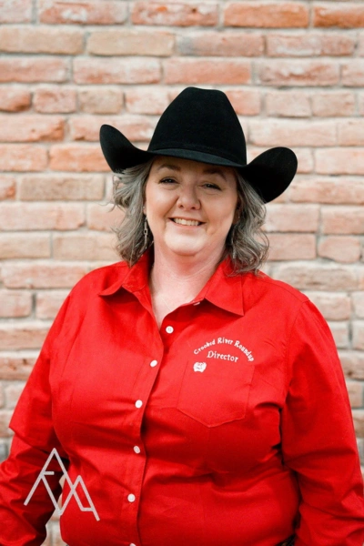 Photo of Laura Davis in red CRR oxford with black hat